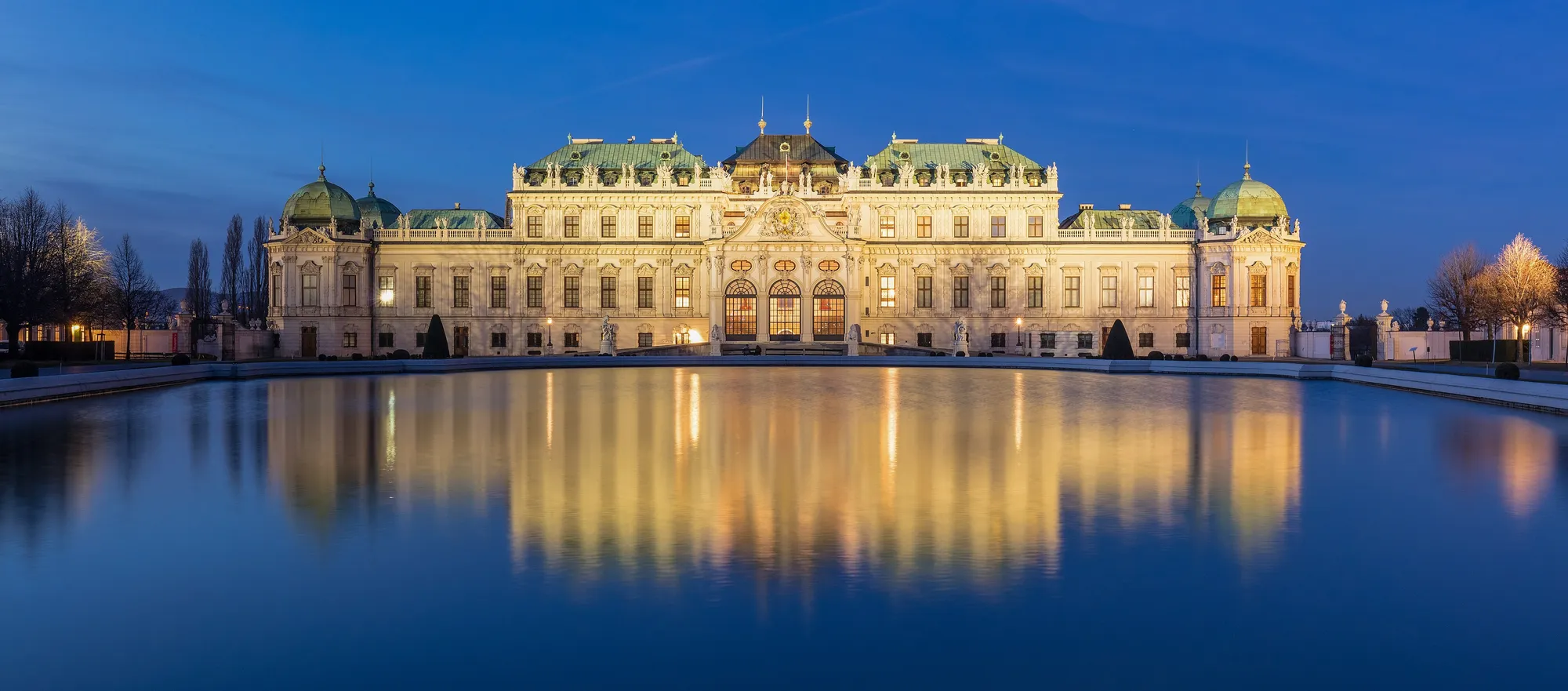 The Upper Belvedere at blue hour, its reflecting pool still in front of the palace.