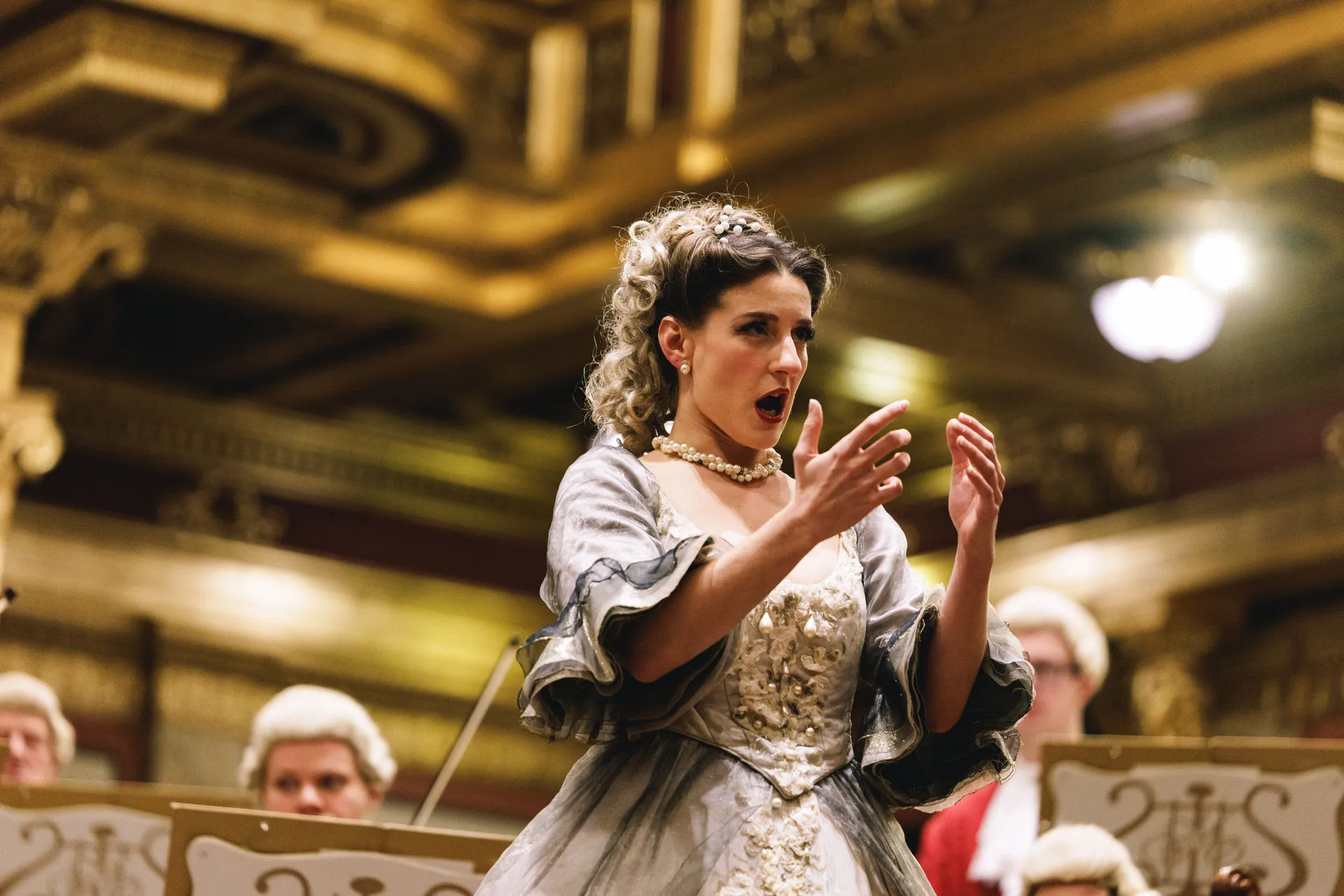 The soprano singing an aria with the orchestra in the Golden Hall.