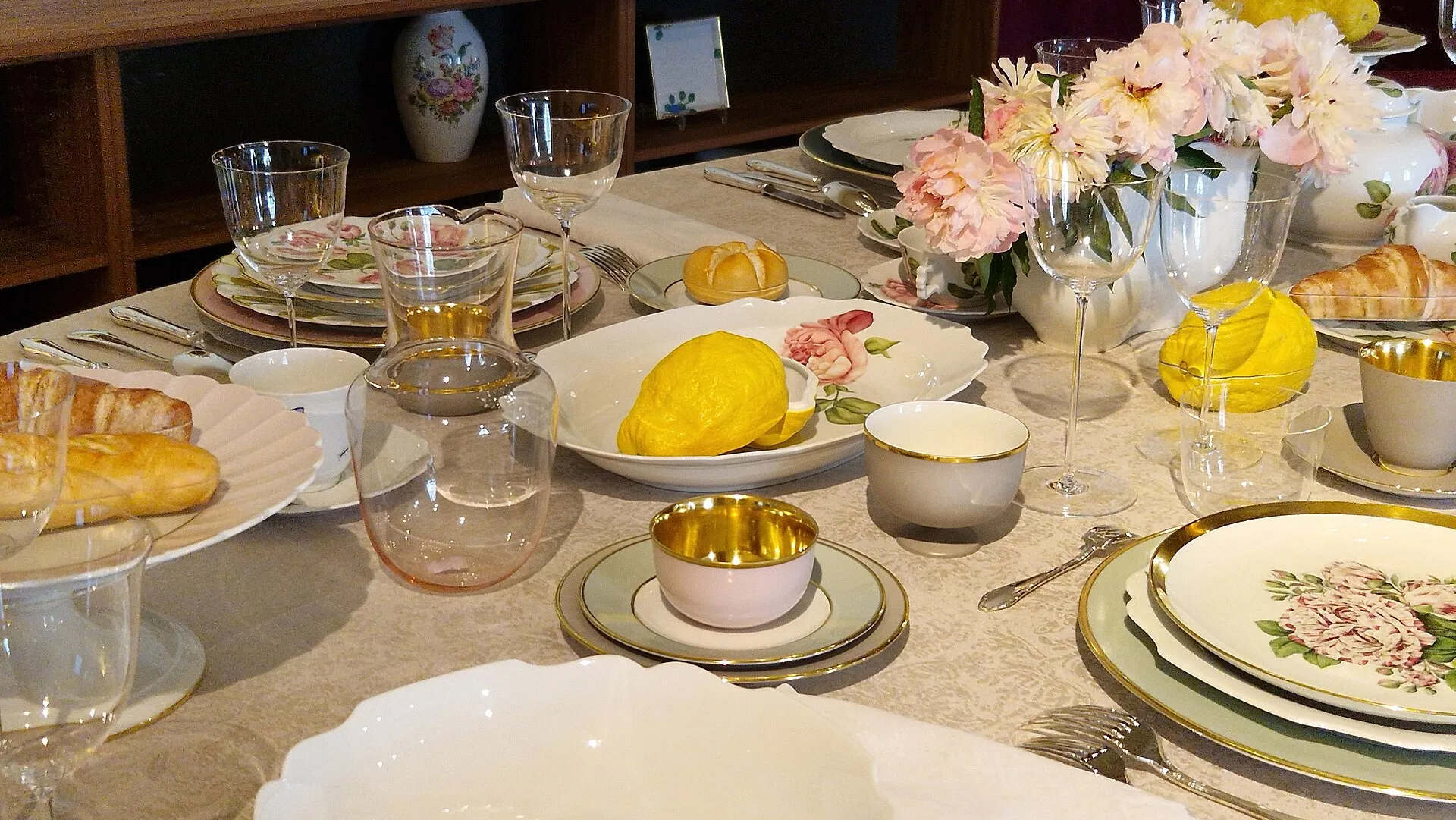 Viennese porcelain with a painted rose decor laid for coffee — cups, saucers and plates