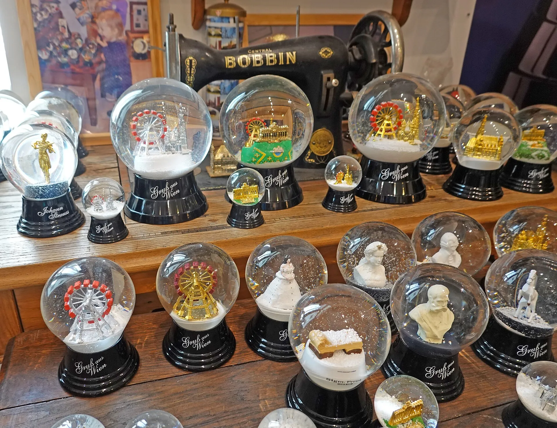 Rows of Viennese souvenir snow globes, the giant Ferris wheel and the city’s churches among them